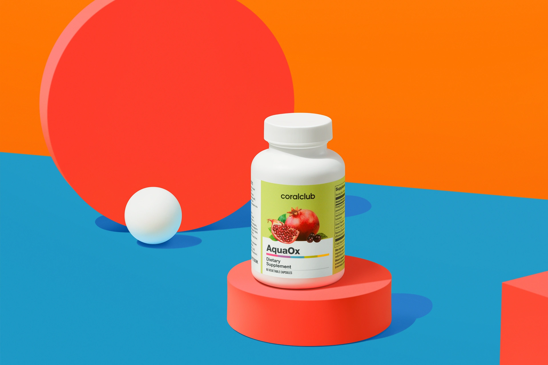 AquaOx-capsules in een lifestyle-omgeving naast granaatappel en cacaobonen